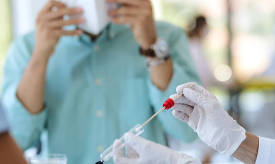 medical professionals using a syringe