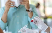 Laboratory workers with pipet and