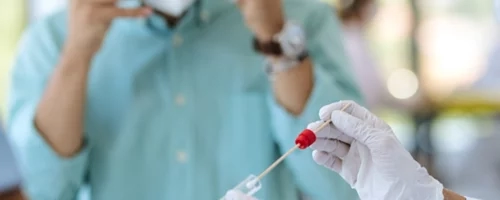 medical professionals using a syringe